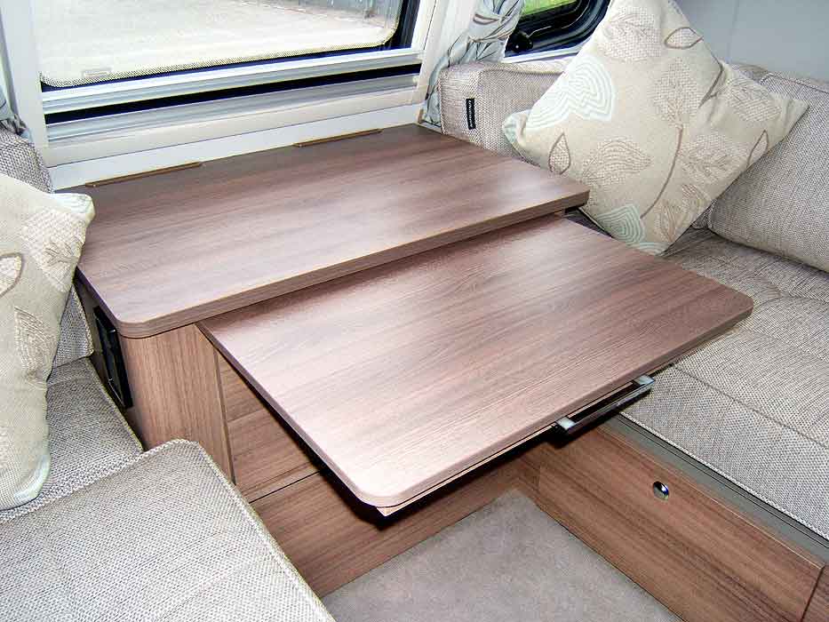 The occasional cabinet table is easy to access and stow away.